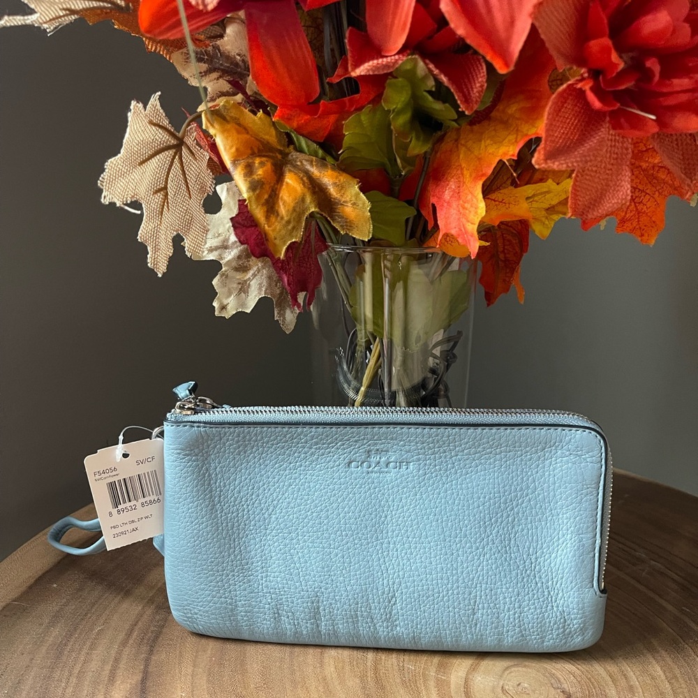 NWT authentic blue coach wristlet.8.5 L x 4.5 H.